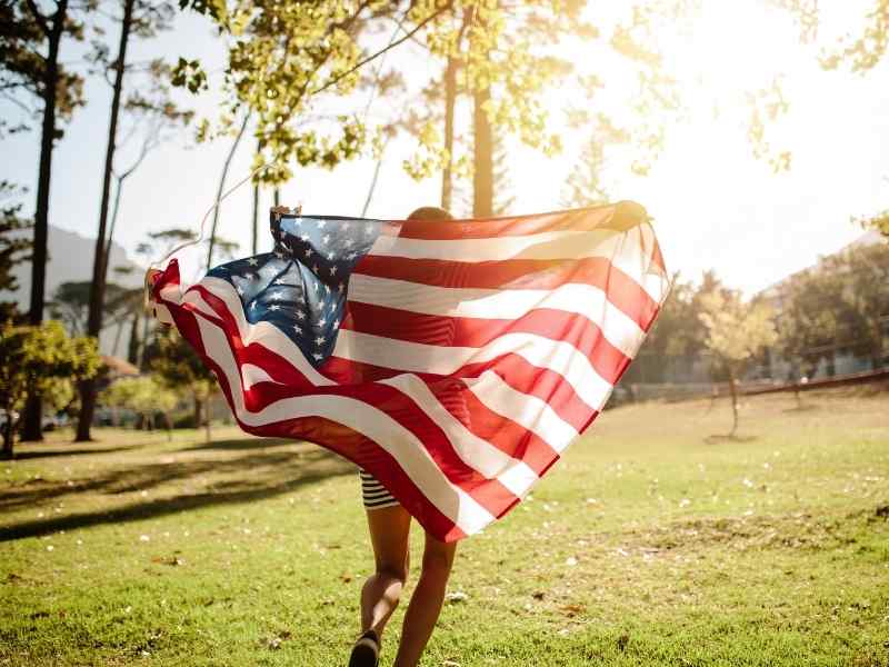 girl holding a US flag